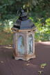two old, historical retro lanterns on a wooden table