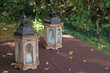 two old, historical retro lanterns on a wooden table