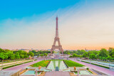 Fototapeta Paryż - Paris Eiffel Tower and Trocadero garden at sunset in Paris, France. Eiffel Tower is one of the most famous landmarks of Paris., toned