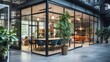 Modern Office Interior: Glass Walls, Plants, and Natural Light. Zen Workspace Light-filled Office Oasis with Lush Greenery
