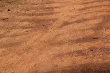 Wall Mural - a walking red path made of rammed sand after sweeping