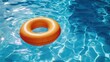 © romanets_v - Orange Inflatable Swimming Ring Floating on Crystal Clear Pool Water