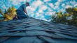 © visoot - A man inspecting a roof after install of shingles. Generative AI.