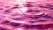 a close up of a water drop in a pool of water with a pink hued background and a drop of water coming out of the top of the water.