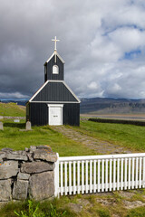 the famous Saurbæjarkirkja wooden, church at the Rauðisandur Beach in iceland.