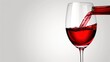 © Liel - a glass of red wine being poured into a wine glass with red wine being poured into the glass with red wine being poured into the glass.