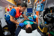 © Raul Navarro/Stocksy - paramedic attending to a patient in an ambulance