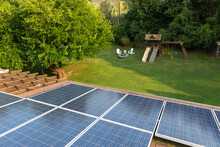Solar Panels  House Roof View To Backyard  With Outdoor Swingset 