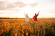 © maxbelchenko - Two Beautiful women in blooming a field. Summer landscape. Fashion, style concept.