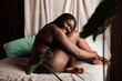 © Lucas Ottone/Stocksy - Confident sexy black woman in underwear