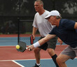 © Ron Alvey/Stocksy - Pickleball dink shot