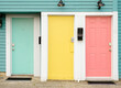 © Maryanne Gobble/Stocksy - Colorful Apartment Building Doors