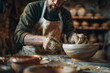 a master potter shaping and glazing handcrafted ceramics in a studio for a special order