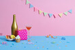 © Marc Tran/Stocksy - Birthday cupcake background with birthday gift, birthday party hat