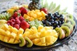 A tray of fruit with a pineapple on top