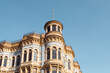 © Maryanne Gobble/Stocksy - Victorian Building and Blue Sky Copyspace