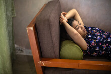 Teenage Indian Girl Relaxing And Taking Rest Inside A House
