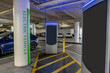 Electric vehicle charging station at parking structure has one car charging and one open stall for renewable energy.