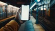 A man holding an phone with a white screen subway background Generative AI