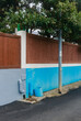 © Jeongho Byeon/Stocksy - Blue wall and fence made of wood.