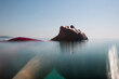© Ibai Acevedo/Stocksy - Relaxed woman floating in the sea