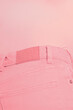 © Colour Laboratory/Stocksy - Close-up of person wearing pink jeans and pink top