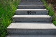 © Colour Laboratory/Stocksy - Concrete stairs with number symbol typographic mark '80 meters'