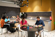 © Hernandez & Sorokina/Stocksy - People Having Lunch At Office Kitchen