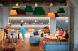 © Hernandez & Sorokina/Stocksy - People In Cozy Office Common Area