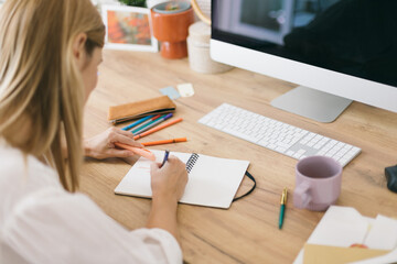 Woman writing in her notebook