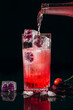 © Marta Mauri/Stocksy - Making a Cherry and flower cocktail