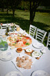 © Adrian Rodd/Stocksy - Elegantly Set Table - A Feast for Diverse Palates