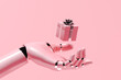 © Marcos Osorio/Stocksy - A robot holding a gift box in its hand