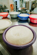 © Anna Tsukanova/Stocksy - Freshly made cheese on cheese factory