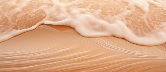 Sticker - A sandy beach with waves constantly coming in and out of the water, creating a dynamic and ever-changing scene along the shore.