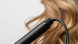 The cord of a hair straightener featuring a swivel end for tanglefree styling.