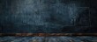 © The 2R Artificiality - The room is devoid of furniture, featuring a black wall at the back and a wooden floor. The contrast between the dark wall and warm floor creates a striking ambiance.