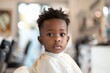 Portrait of a little boy in a barbershop