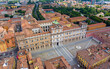 Modena, Italy. Palace - Palazzo Ducale di Modena. Piazza Roma - City square. Panorama of the city on a summer day. Sunny weather with clouds. Aerial view