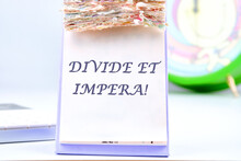 Latin Quote Divide Et Impera Meaning Divide And Conquer. The Best Method Of Governing Such A State Is To Incite And Use Hostility Between Its Parts. Text Written On The Desktop Calendar