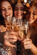 © Athena - Girls celebrate with bubbly Prosecco on a night out