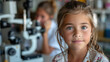 © tong2530 - A male ophthalmologist checks the eyesight of a preschooler girl for an annual examination.