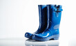 Blue waterproof rubber boots on a white background