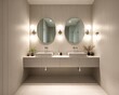 © Fred - Chic bathroom with twin vessel sinks and round looking glasses illuminated by wall sconces