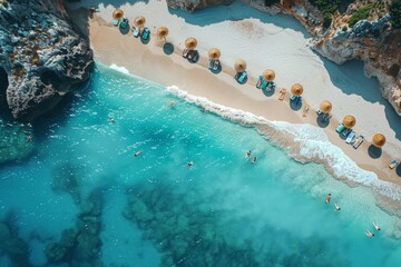 A perfect beach with blue water and golden sand. There are beautiful wooden umbrellas and sun loungers on the sand. view from above. Girls in white swimsuits lie on sunbeds.