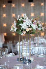 Wall Mural - Luxury wedding table setting with flower centerpieces and candles