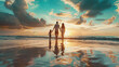 Happy family walking on the beach on the dawn time with beautiful cloudy sky 