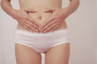 © NanSan - Close-up of woman wearing white panties On a white background about menstruation, cervical cancer, ovarian cancer.