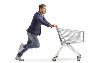 Poster - Excited young man running with a supermarket shopping cart