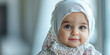 Banner with small cute arab baby girl in hijab and place for text.